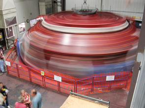 To ensure even distribution of the molten glass and to create the parabolic shape of the mirror segment, the furnace rotates at just under five revolutions per minute. Shown here is the furnace during the casting of GMT mirror 3 in 2013. (Photo: Giant Magellan Telescope – GMTO Corp.) To ensure even distribution of the molten glass and to create the parabolic shape of the mirror segment, the furnace rotates at just under five revolutions per minute. Shown here is the furnace during the casting of GMT mirror 3 in 2013. (Photo: Giant Magellan Telescope – GMTO Corp.)